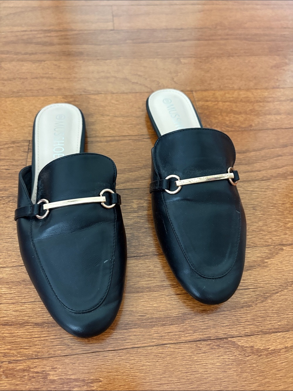 Black Leather Slip-On Loafers with Gold Accent